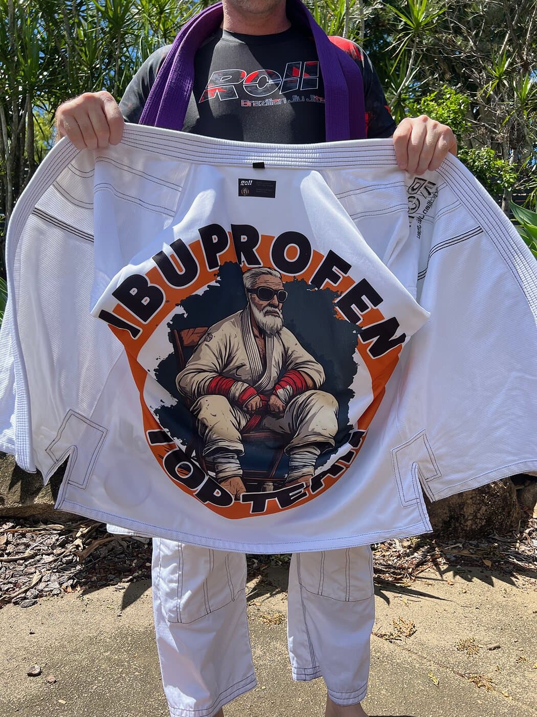Ibuprofen Top Team gi held open, showing the printed inner liner