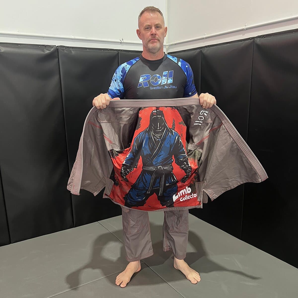Limb Collector gi held open on the mats, showing the printed inner liner